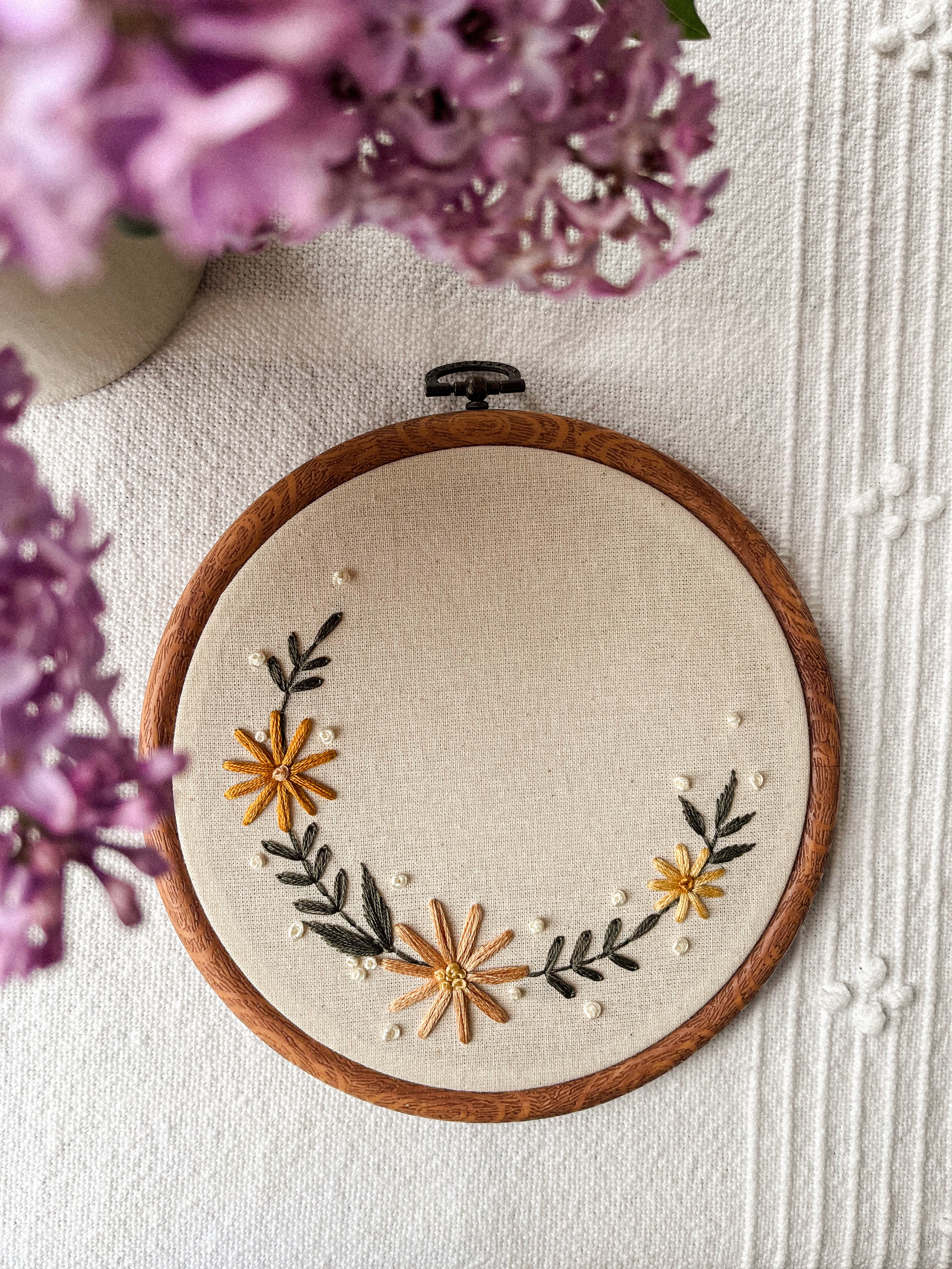 Embroidery with name and small floral wreath