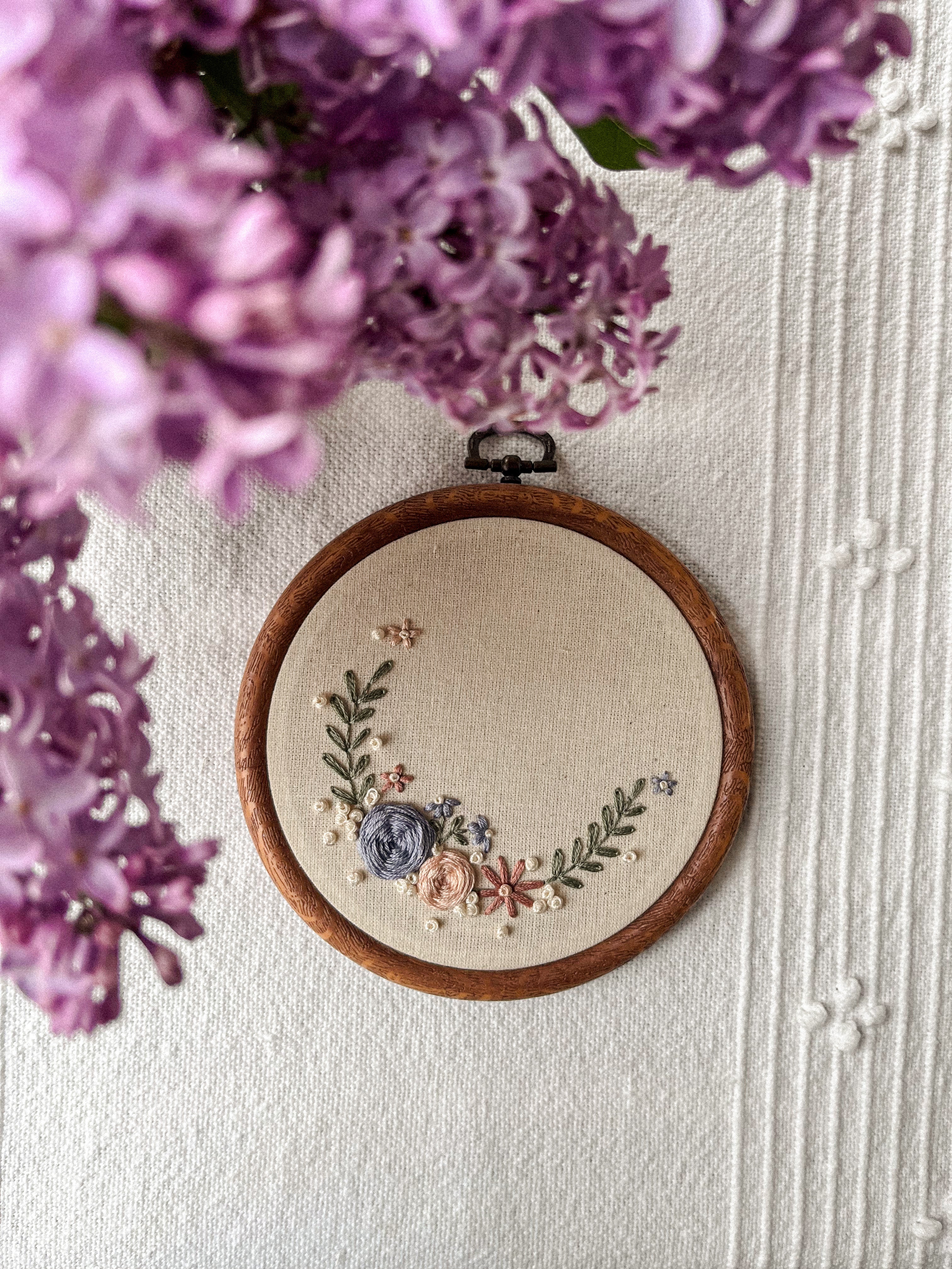 Embroidery with name and small floral wreath